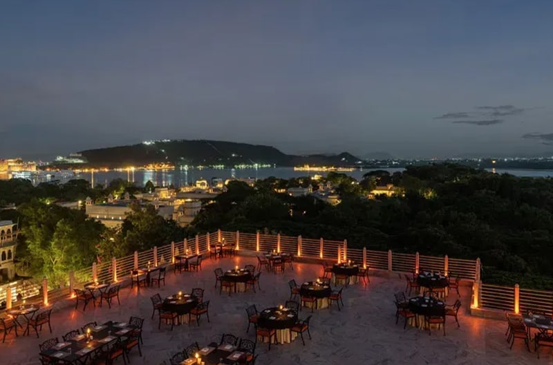 Rooftop candlelit dining with lake views