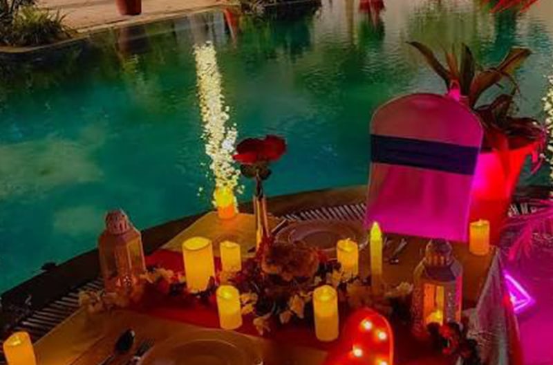 Candlelit rooftop poolside dinner moments